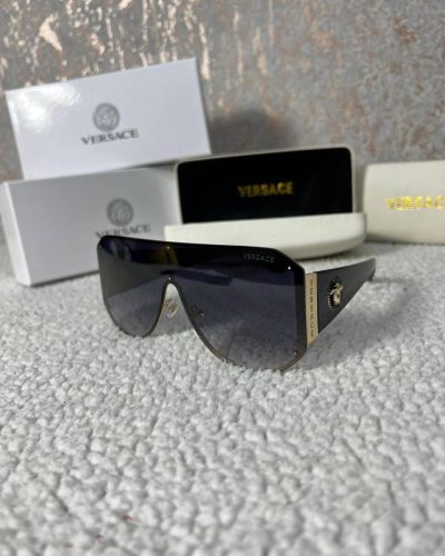 Versace brand Frameless design Black color Eyewear product Stylish and trendy High-quality material Iconic logo Fashionable accessory Lightweight and comfortable UV protection