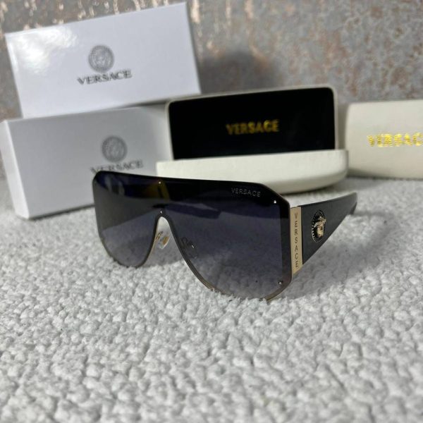 Versace brand Frameless design Black color Eyewear product Stylish and trendy High-quality material Iconic logo Fashionable accessory Lightweight and comfortable UV protection