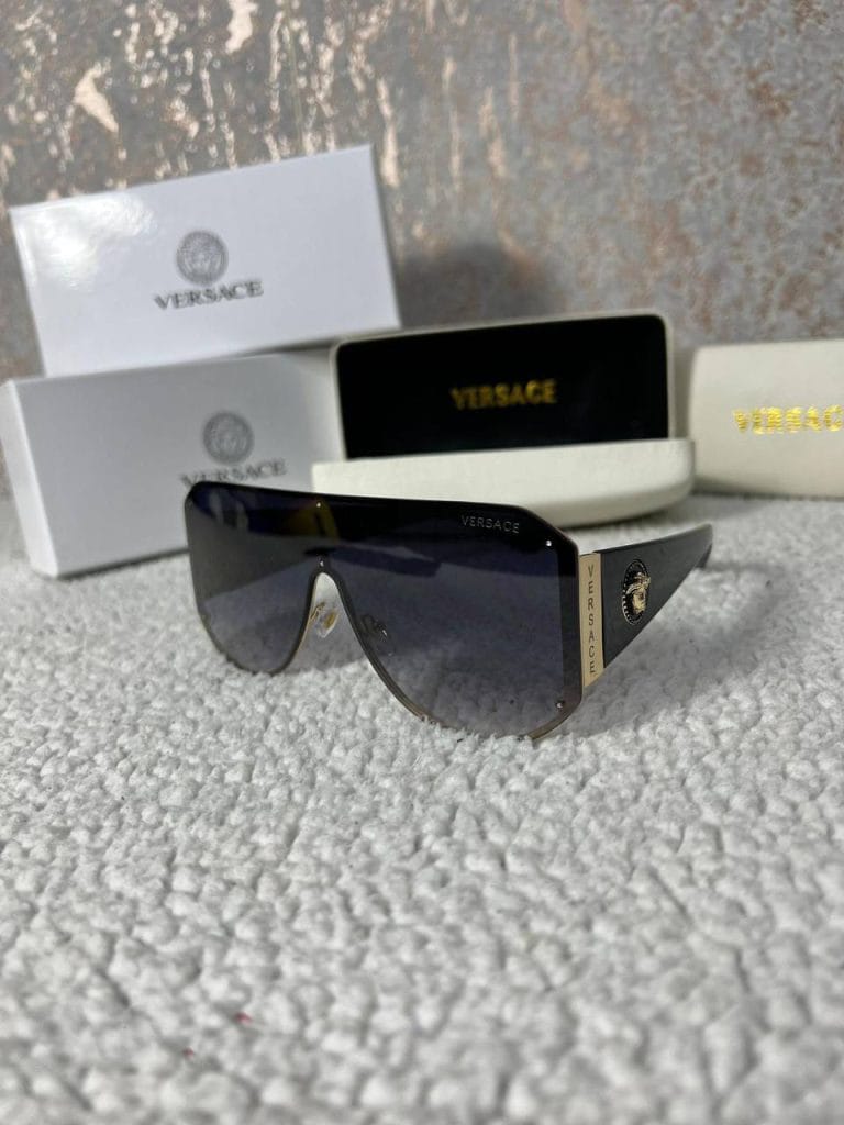 Versace brand Frameless design Black color Eyewear product Stylish and trendy High-quality material Iconic logo Fashionable accessory Lightweight and comfortable UV protection