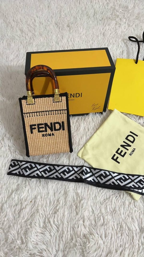 Front shot of Fendi Sunshine Mini Tote in natural beige cotton with brown leather FENDI ROMA lettering. Front shot of Fendi Sunshine Mini Tote in natural beige cotton with brown leather FENDI ROMA lettering.