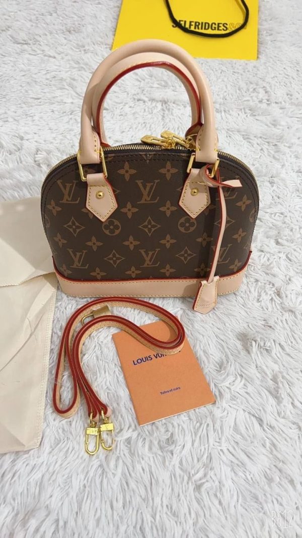 Front View of Louis Vuitton Replica Alma PM Crossbody Bag in Brown Monogram Leather Front View of Louis Vuitton Replica Alma PM Crossbody Bag in Brown Monogram Leather