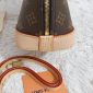 Side Angle Showing Structure and Stitch Detailing of the Fake LV Alma Handbag