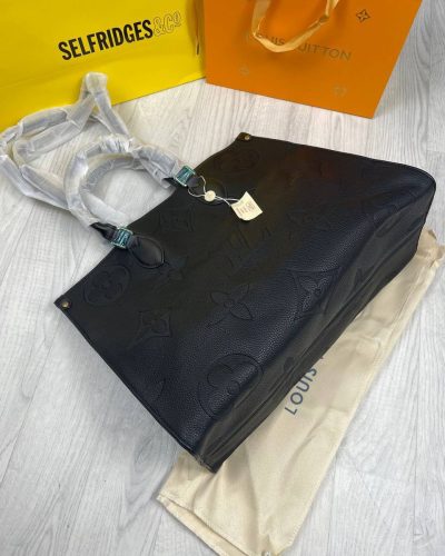 Top open view of Louis Vuitton Empriente Tote Bag showing spacious interior and zipper closure. Top open view of Louis Vuitton Empriente Tote Bag showing spacious interior and zipper closure.