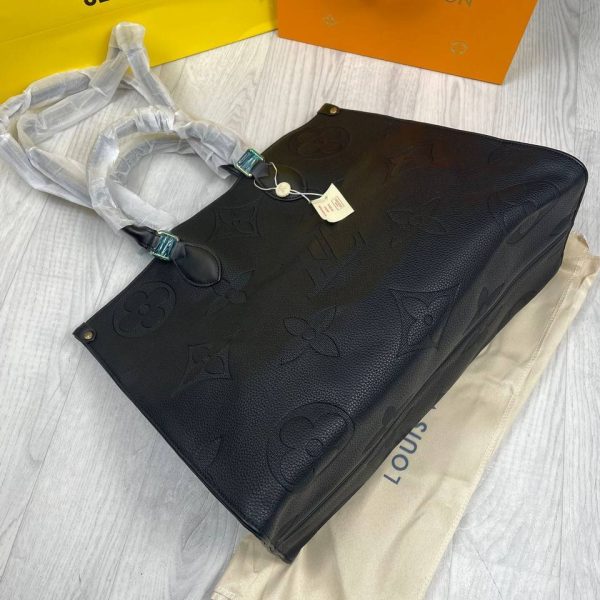 Top open view of Louis Vuitton Empriente Tote Bag showing spacious interior and zipper closure.