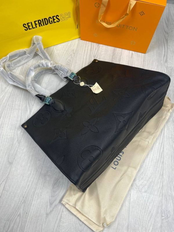 Top open view of Louis Vuitton Empriente Tote Bag showing spacious interior and zipper closure. Top open view of Louis Vuitton Empriente Tote Bag showing spacious interior and zipper closure.