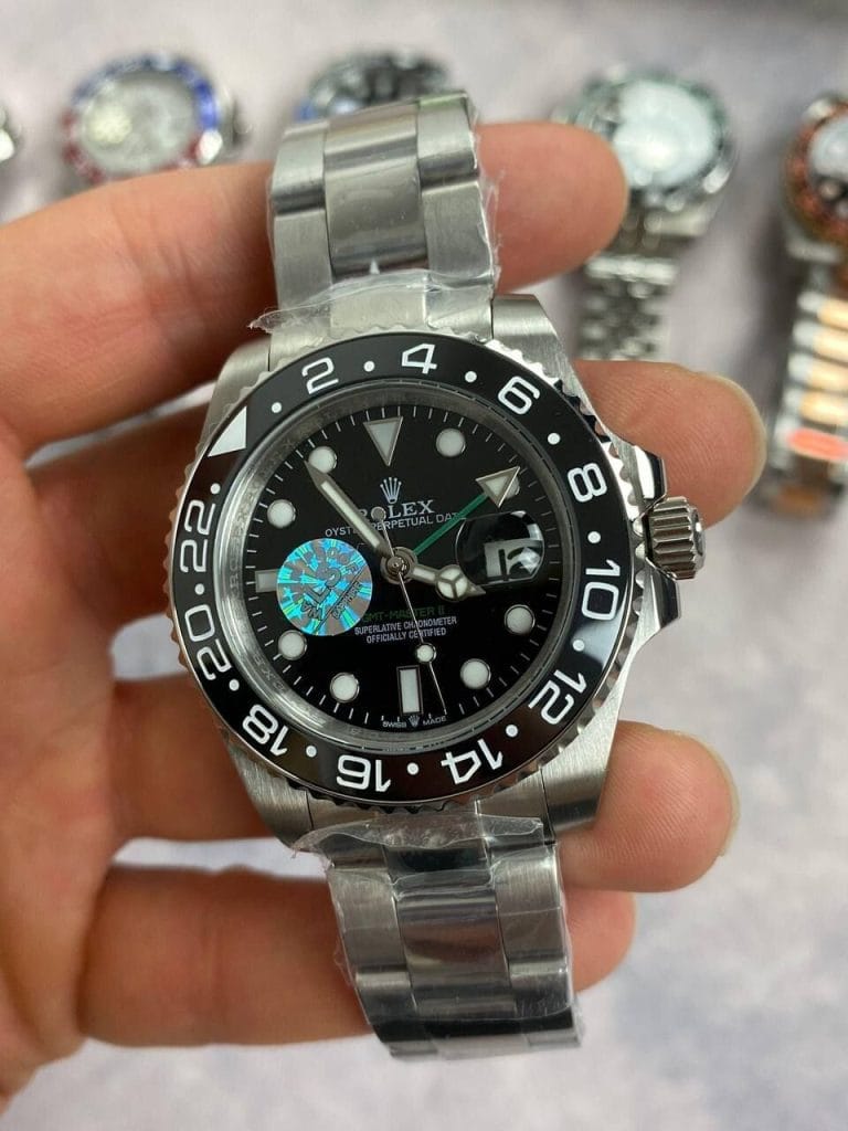 Rolex GMT Master II With Silver Chain Strap and Black Dial