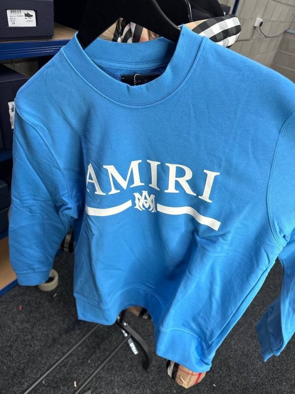 Amiri blue cotton jumper with stitched logo patch on chest Amiri blue cotton jumper with stitched logo patch on chest