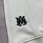 Close-up Amiri logo on jumper white black