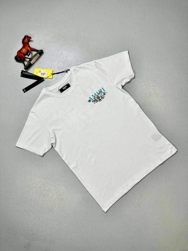 Luxury Amiri T-Shirt for Men with White Flowers & Front Logo Luxury Amiri T-Shirt for Men with White Flowers & Front Logo