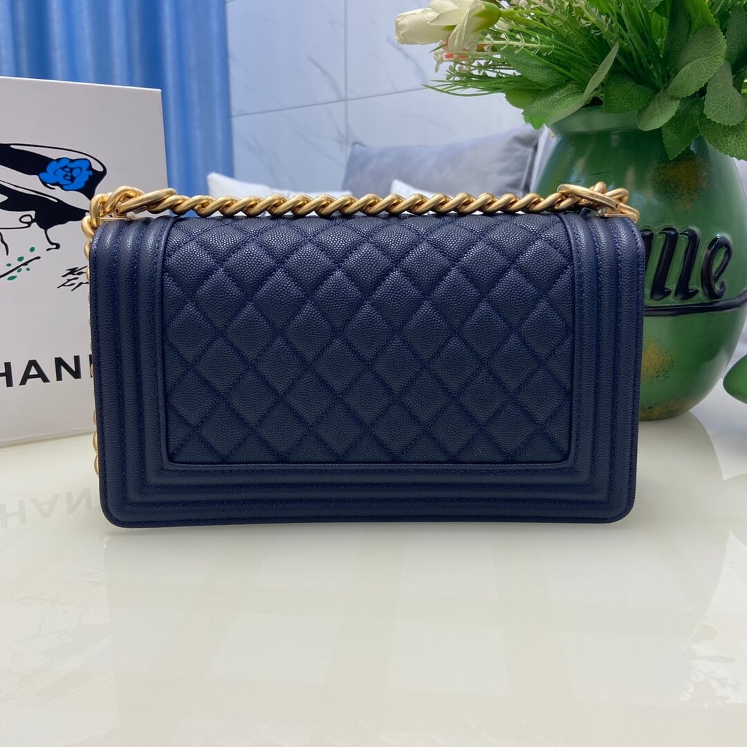 Back view of navy Boy Chanel bag with bordered diamond quilting