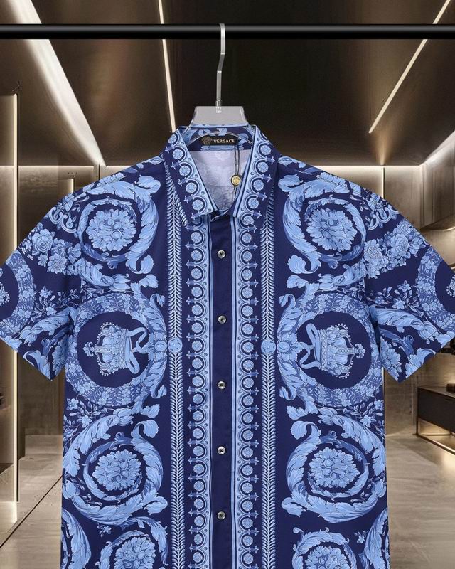 Close view of blue Versace shirt collar and baroque print