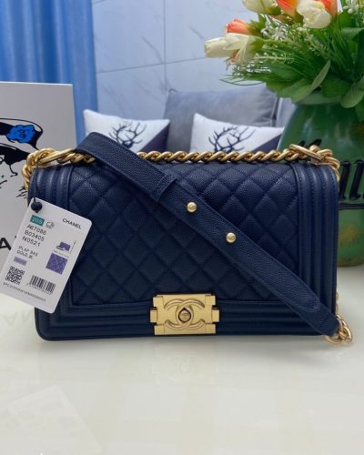 Navy blue Boy Chanel bag with gold brick clasp and chunky chain front view
