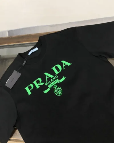 Prada Black Cotton T-Shirt with Green Logo and Embroidered Detail Super Clone Quailty Close veiw Prada Black Cotton T-Shirt with Green Logo and Embroidered Detail Super Clone Quailty Close veiw