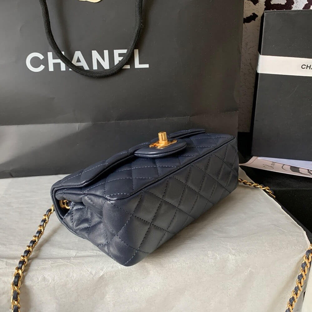 Quilted lambskin bottom view of navy Chanel mini flap bag