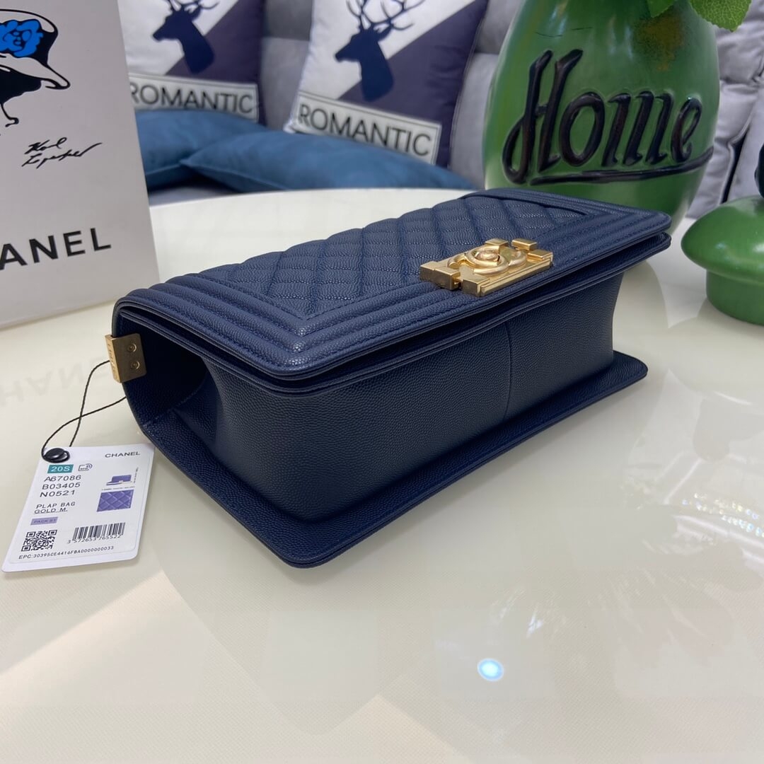 Structured bottom view of navy caviar leather Boy Chanel bag