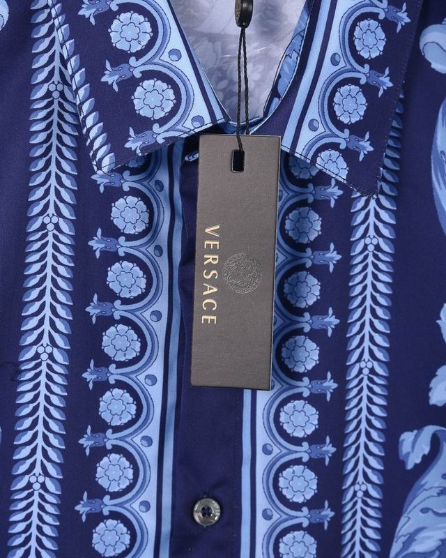 Versace brand hang tag with gold logo on blue baroque shirt